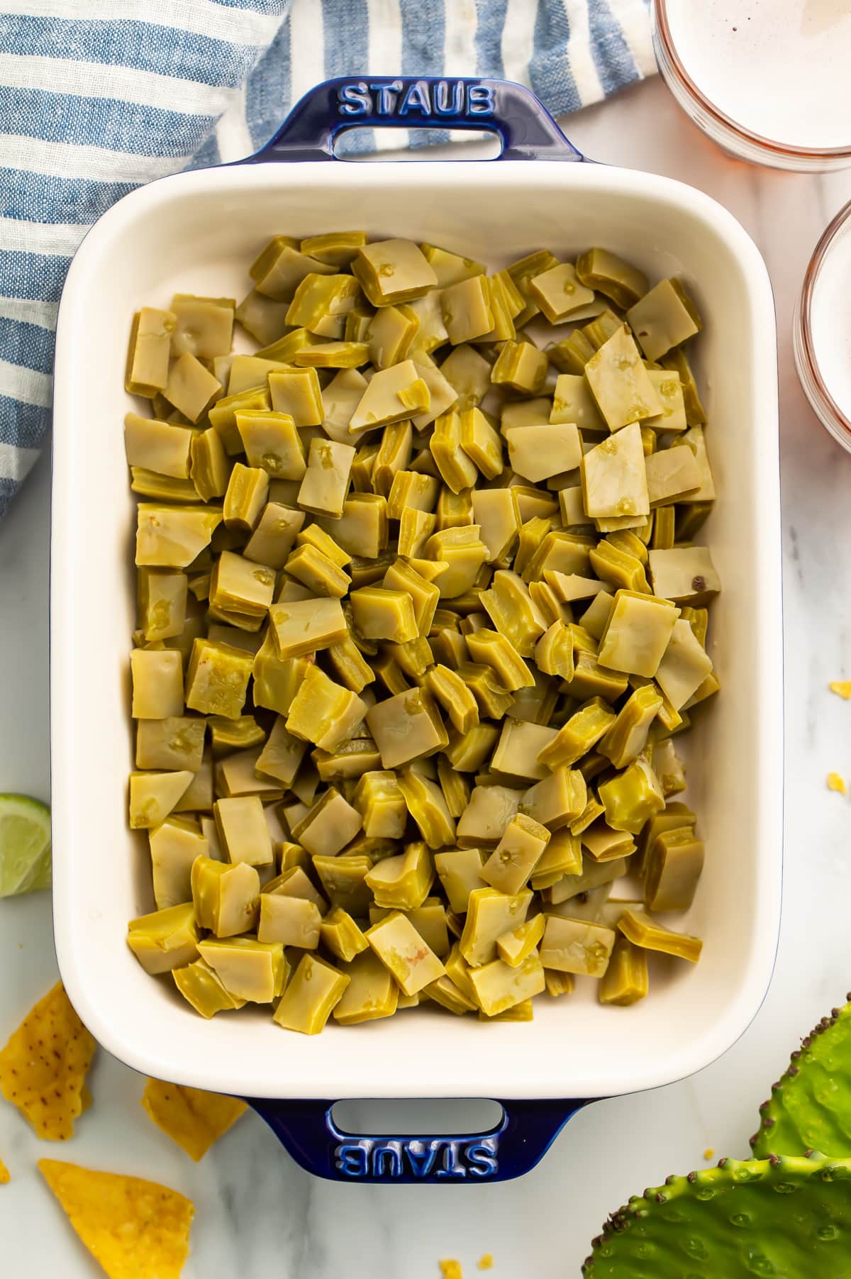 Top-down photo of a casserole dish filled with diced nopales.