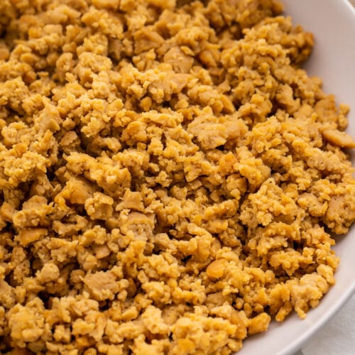 A bowl of crumbled ground beef made from seitan.