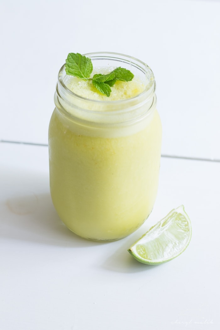 Mango mojito smoothie. Literally, summer in a glass. Creamy, frothy, sweet, fresh.. just perfect.