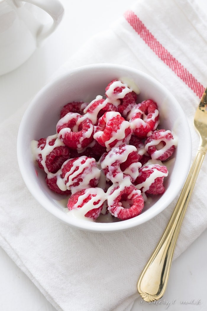 The simplest ever raspberries and cream: tart, juicy raspberries and sweet, creamy sweetened condensed milk. Too delicious not to share.