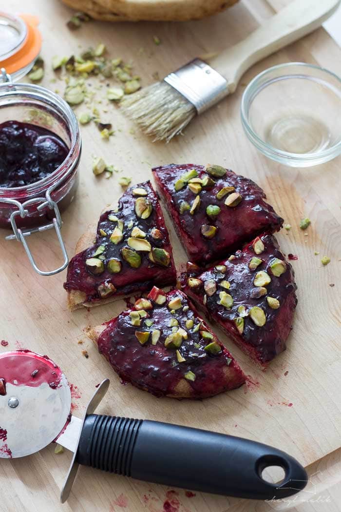 Breakfast Pizza (vegan). Whole wheat pita, salty pistachios, and fruity, gooey jam. So versatile and perfectly satisfying in the morning!