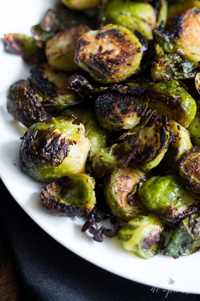 Crispy miso roasted brussel sprouts - in a miso, white wine, and butter sauce, these brussel sprouts are crazy good and so simple! Perfect for Thanksgiving