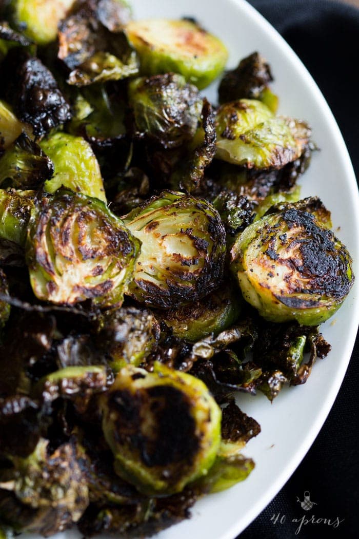 Crispy miso roasted brussel sprouts - in a miso, white wine, and butter sauce, these brussel sprouts are crazy good and so simple! Perfect for Thanksgiving