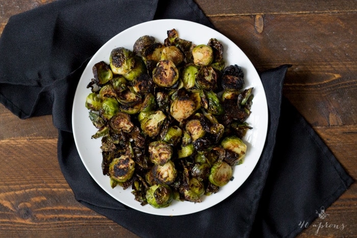 Crispy miso roasted brussel sprouts - in a miso, white wine, and butter sauce, these brussel sprouts are crazy good and so simple! Perfect for Thanksgiving