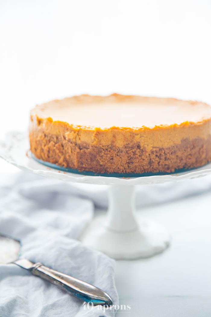 Vegan pumpkin cheesecake on a cake stand