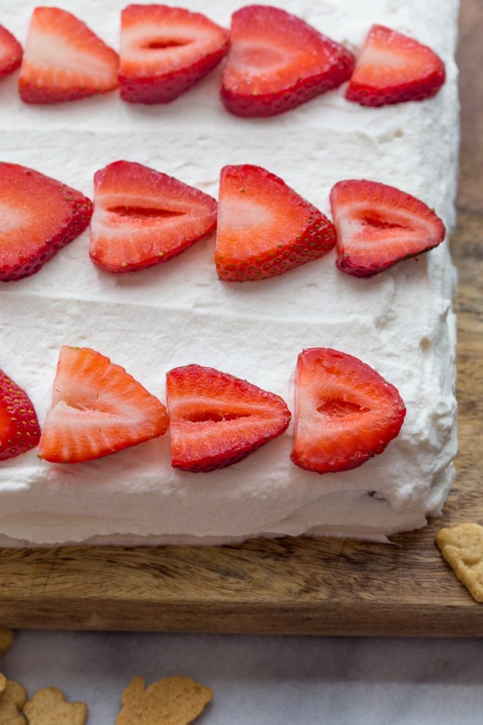 Flag Cake with Whipped Cream Frosting & Bunny Grahams // Rich yellow cake with a whipped cream-cream cheese frosting, finished with fresh fruit and sweet Bunny Grahams. Happy 4th of July, you beautiful patriot, you.