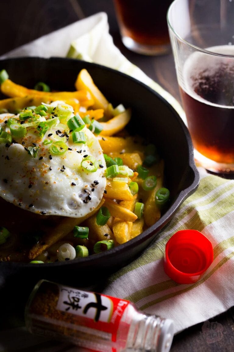 Japanese curry fries. Definition of epic. Rich, spiced Japanese curry sauce smothers crispy fries, topped with an egg over easy. Mama. // 40 Aprons