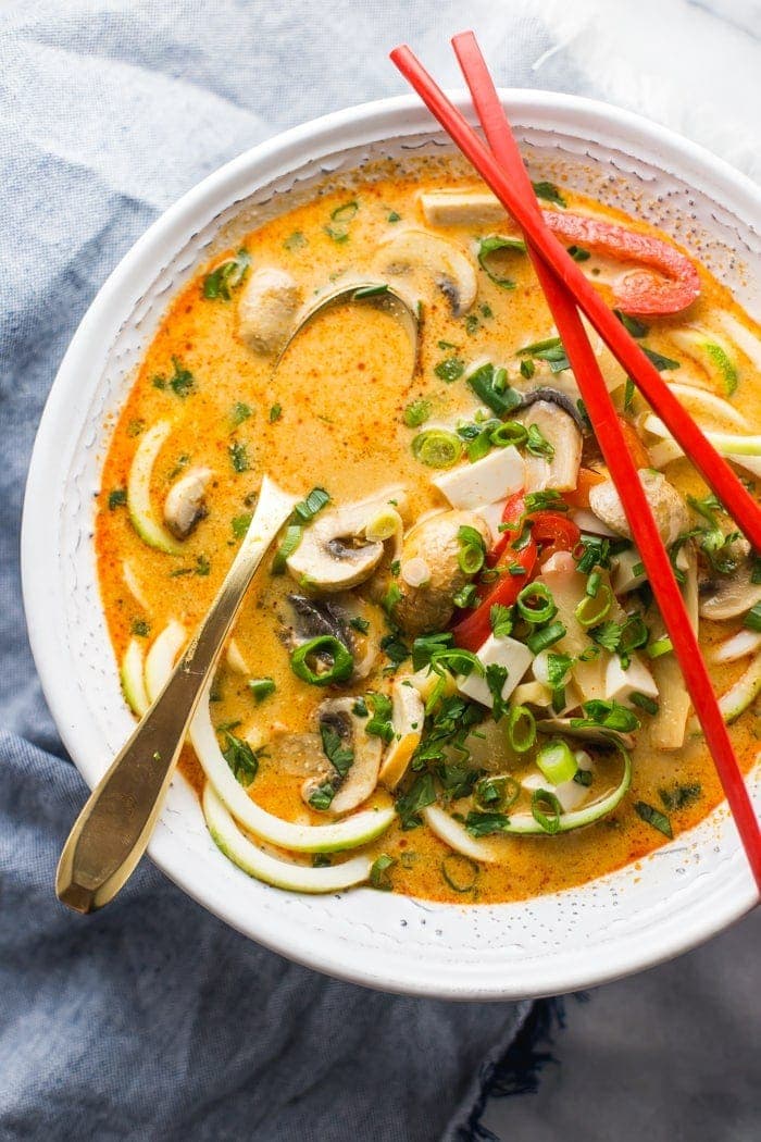 This paleo coconut curry zoodle soup is quick and delicious, loaded with creamy coconut milk, intensely flavorful red curry paste, and zoodles. This recipe is a wonderful paleo dinner or paleo soup recipe to add to your collection. Low carb yet filling, you can make this paleo coconut curry zoodle soup a vegan coconut curry zoodle soup with an easy swap! 