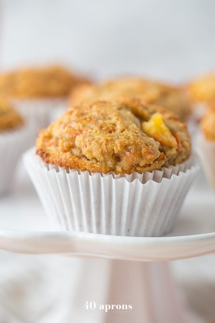 These peach ginger paleo muffins are moist and tender, full of fruity, fresh peaches and earthy ginger. The best thing about these paleo muffins? They don't taste like they're paleo! Grain-free, gluten-free, and refined sugar-free, these make an awesome paleo breakfast, too.