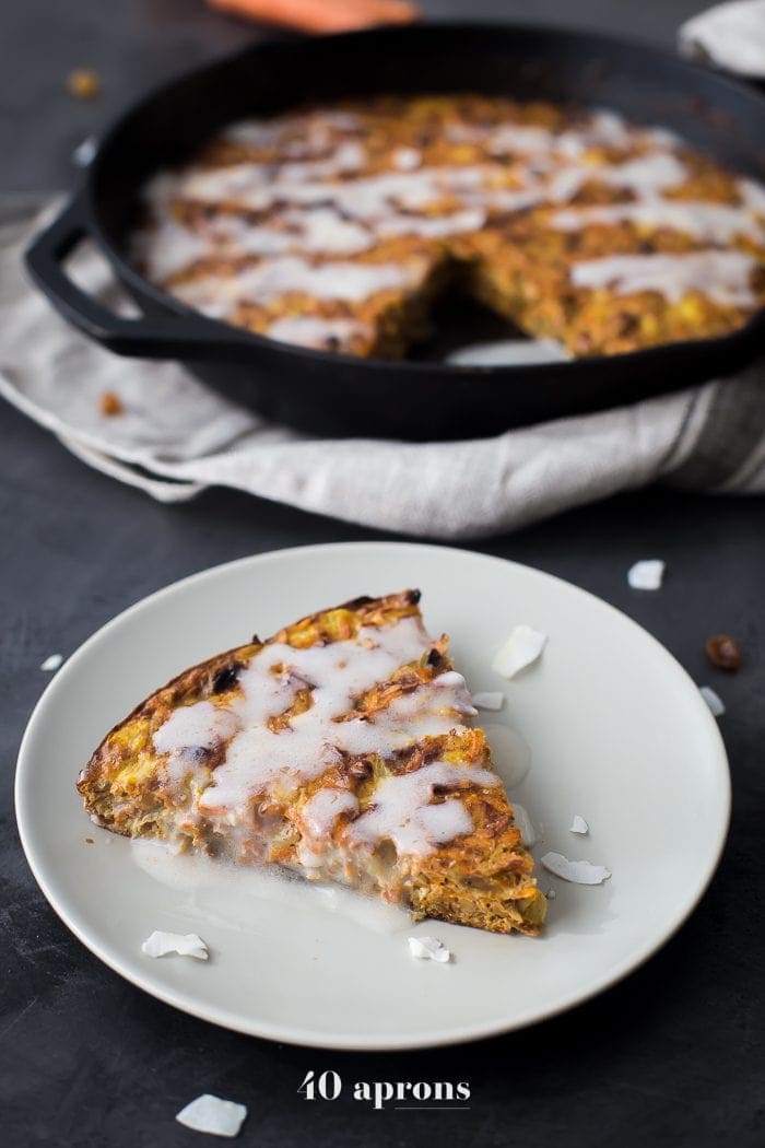 This carrot cake paleo breakfast bake is like eating carrot cake for breakfast! With pineapple, golden raisins, coconut, cinnamon, walnuts, and a paleo cream cheese glaze, this paleo breakfast bake is easy but delicious. Destined to become a regular on your paleo breakfast bake roster!