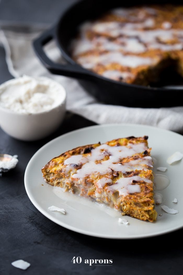 This carrot cake paleo breakfast bake is like eating carrot cake for breakfast! With pineapple, golden raisins, coconut, cinnamon, walnuts, and a paleo cream cheese glaze, this paleo breakfast bake is easy but delicious. Destined to become a regular on your paleo breakfast bake roster!