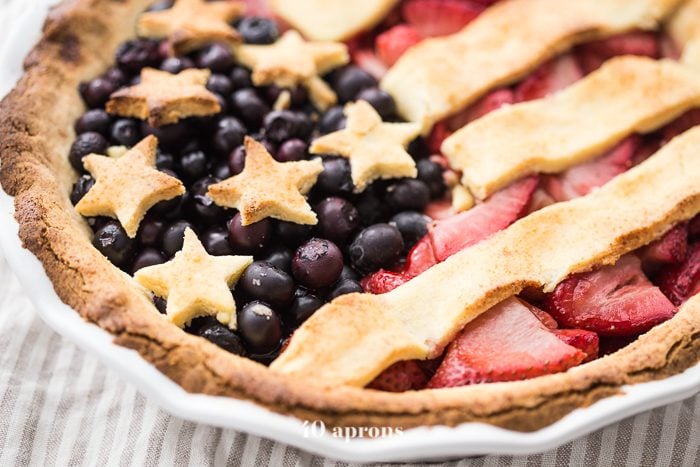 This paleo American flag pie is the absolute perfect paleo 4th of July dessert. Full of fresh strawberries and blueberries with a crunchy crust, it's a stellar paleo pie that's just stunning. Is there a better paleo pie for the ultimate paleo 4th of July dessert table? I think not!