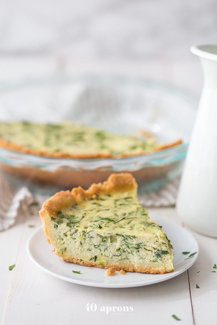 This paleo quiche with crab and spinach is a fantastic paleo Mother's Day brunch recipe, but it's versatile and quick enough to become a favorite paleo dinner or paleo brunch dish in your rotation. With an almond flour crust, this paleo quiche is so much like a cheesy, gluteny quiche!