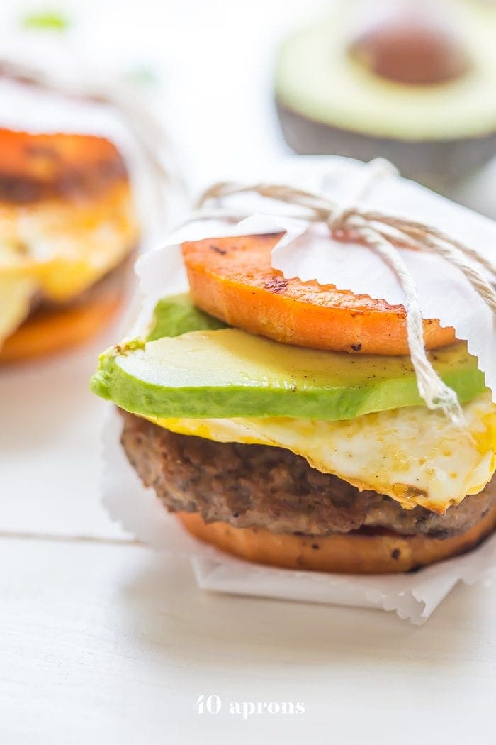 These Whole30 breakfast sandwiches are easy to make and insanely good. Buttery sweet potato buns layered with Whole30 breakfast sausage, fried egg, and avocado or quick Whole30 chipotle aioli, they're about to be your favorite Whole30 breakfast.