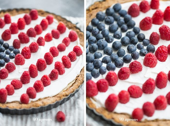 This paleo flag fruit tart is Fourth of July dessert perfection. With a coconut oil shortbread crust, rich almond frangiapane filling, and topped with cool coconut cream and fresh fruit, you've got your paleo Fourth of July dessert covered. Why make a paleo 4th of July cake when you can make a tart delicious enough to beat all other paleo 4th of July desserts?! U-S-A! U-S-A!