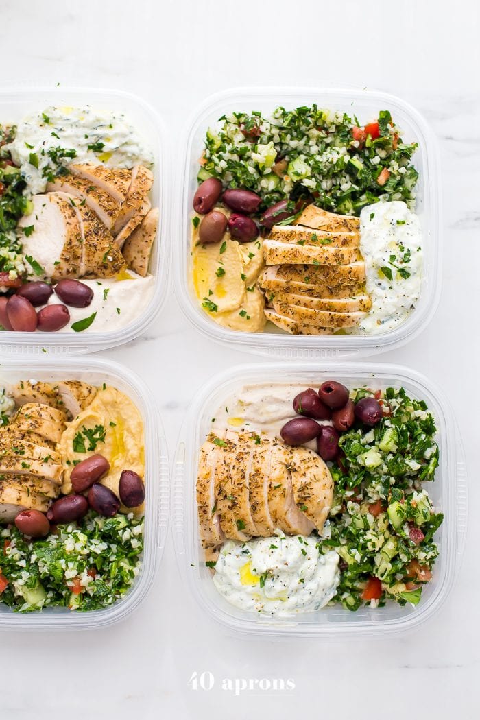 This Greek healthy meal prep recipe is epic: cauliflower rice tabbouleh, tender seasoned chicken breasts, hummus or baba ganoush, kalamata olives, and a rich, garlicky tzatziki. This healthy meal prep recipe will have you looking forward to lunch all morning! It's also a Whole30 meal prep recipe and paleo meal prep recipe, too, when you sub coconut cream or coconut yogurt for the yogurt. This is seriously SUCH a perfect healthy meal prep recipe.