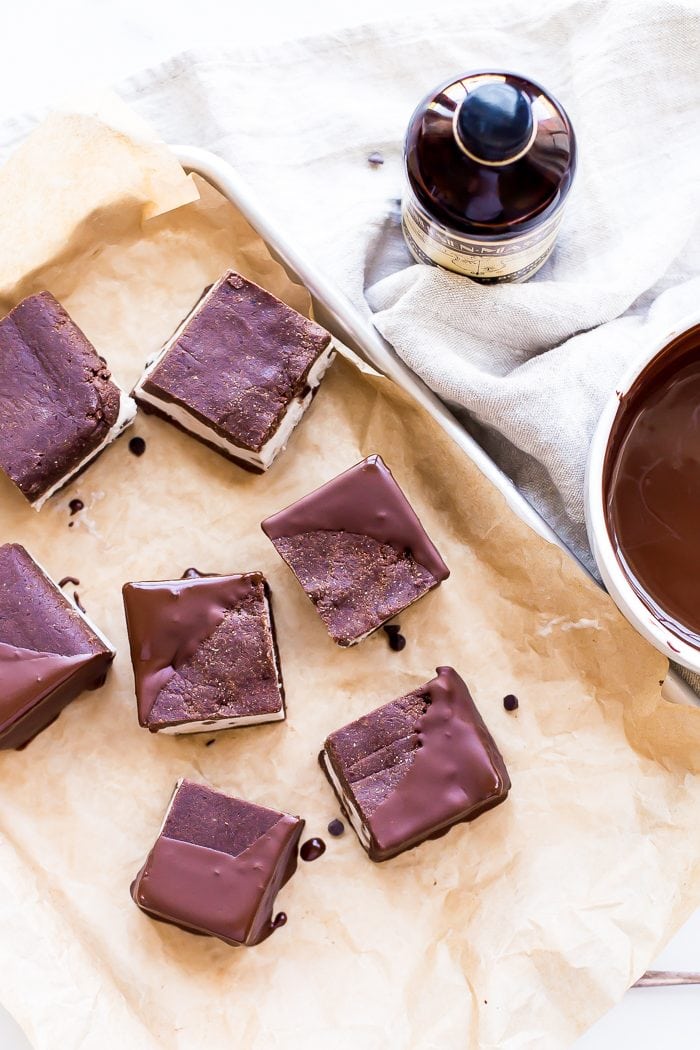 These healthy vegan ice cream sandwiches are out of control! Chocolate chip "nice cream" sandwiched between two raw chocolate cookies, dipped in chocolate? These healthy vegan ice cream sandwiches are basically about to be your breakfast, lunch, and dinner... If you're looking for healthy paleo ice cream sandwiches, you've come to the right place, my friend!