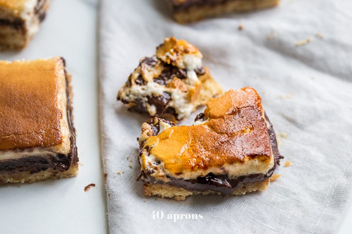 These paleo smores bars are the perfect paleo dessert this summer. A graham cracker crust, topped with chocolate and a burnt marshmallow layer, they're inspired by the classic summer treat but are grain-free, dairy-free, and refined-sugar-free. These paleo smores bars are great for entertaining!