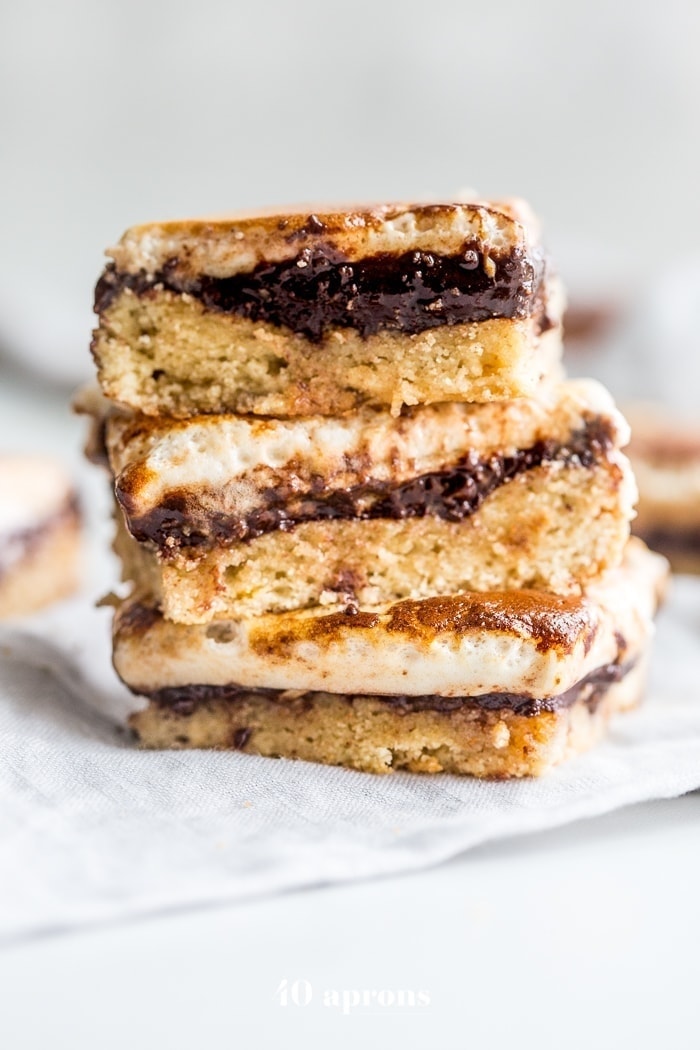 These paleo s'mores bars are the perfect paleo dessert this summer. A graham cracker crust, topped with chocolate and a burnt marshmallow layer, they're inspired by the classic summer treat but are grain-free, dairy-free, and refined-sugar-free. These paleo s'mores bars are great for entertaining!