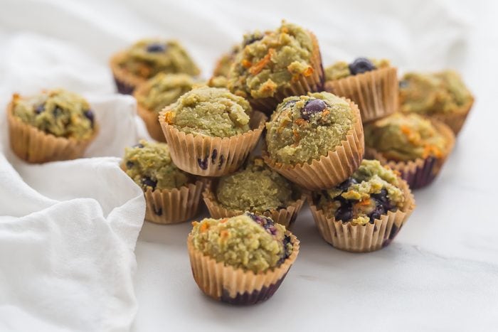 These gluten-free muffins for kids (with blueberries and avocado) are the perfect back-to-school muffins! Gluten and grain free, made with cultured dairy, and with low sugar, they're great to serve to a class, too. These gluten-free muffins for kids are packed with fruits and veggies, including carrots, avocado, and blueberries! I think your family will love these gluten-free muffins for kids just as much as mine does.