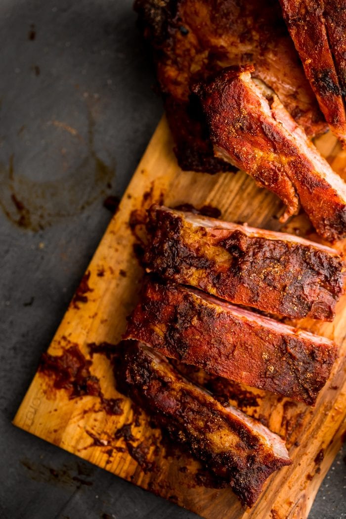 These Whole30 ribs are easy and cooked on the grill, making them a great Whole30 dinner! Smoky, spicy, and full of flavor, they're delicious with my Whole30 BBQ sauce. Definitely the perfect Whole30 ribs or Whole30 dinner now that football season is upon us!