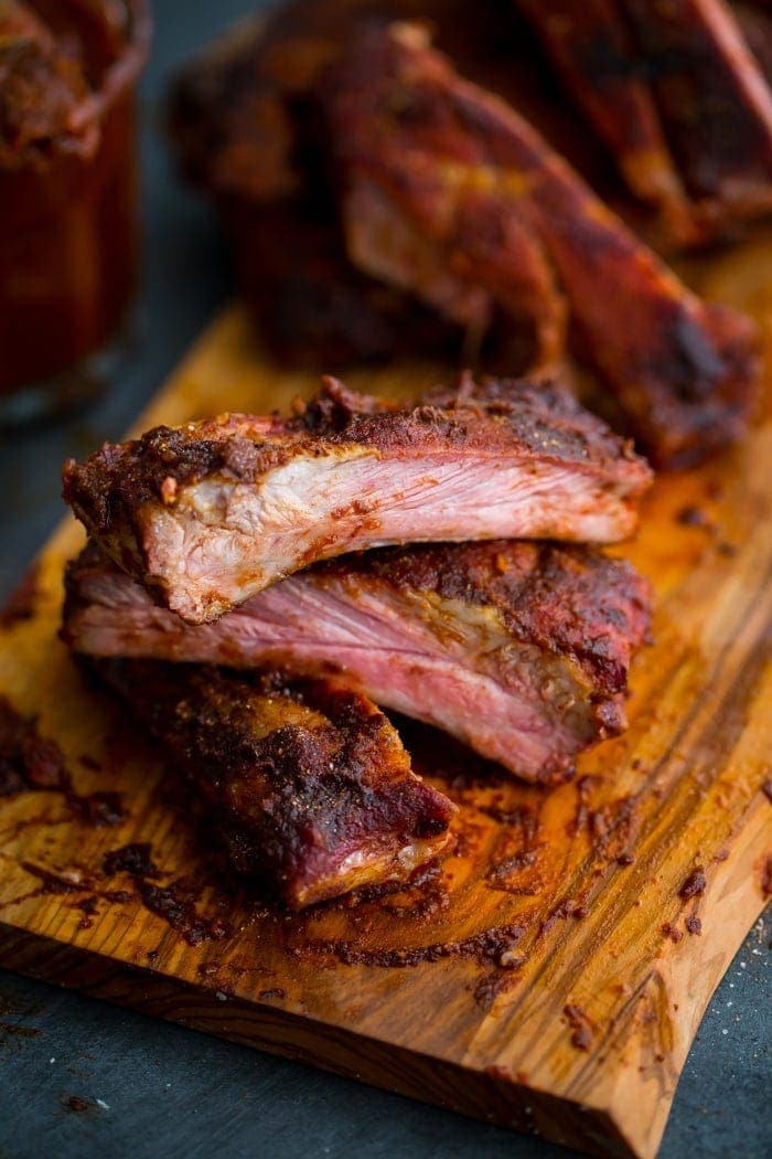 These Whole30 ribs are easy and cooked on the grill, making them a great Whole30 dinner! Smoky, spicy, and full of flavor, they're delicious with my Whole30 BBQ sauce. Definitely the perfect Whole30 ribs or Whole30 dinner now that football season is upon us!