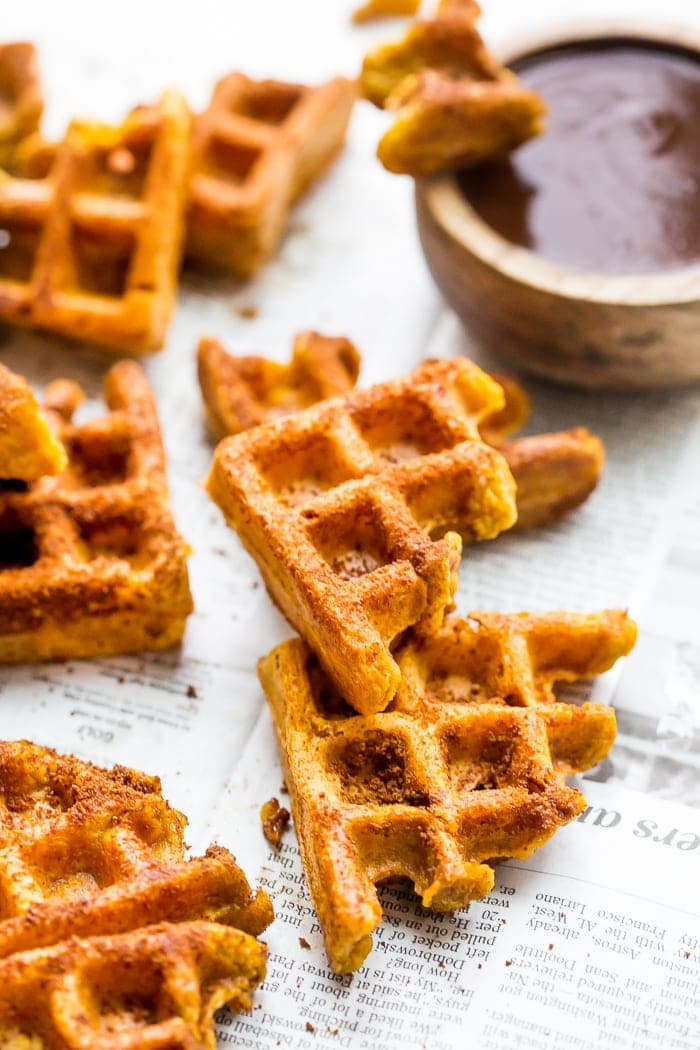 These paleo pumpkin churros with dark chocolate sauce are heavenly: loaded with fall flavor, crispy on the outside, tender on the inside, and made in the waffle iron! They're such a perfect paleo fall recipe because they're totally delicious but there's no frying necessary. These paleo pumpkin churros with dark chocolate sauce are a must make when it comes to paleo fall recipes!