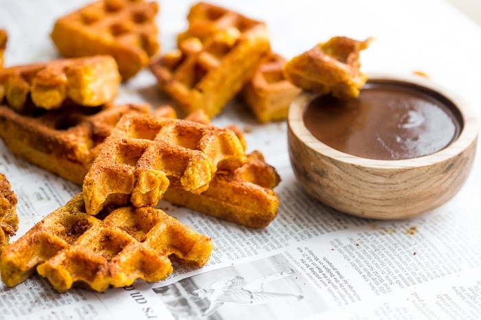 These paleo pumpkin churros with dark chocolate sauce are heavenly: loaded with fall flavor, crispy on the outside, tender on the inside, and made in the waffle iron! They're such a perfect paleo fall recipe because they're totally delicious but there's no frying necessary. These paleo pumpkin churros with dark chocolate sauce are a must make when it comes to paleo fall recipes!