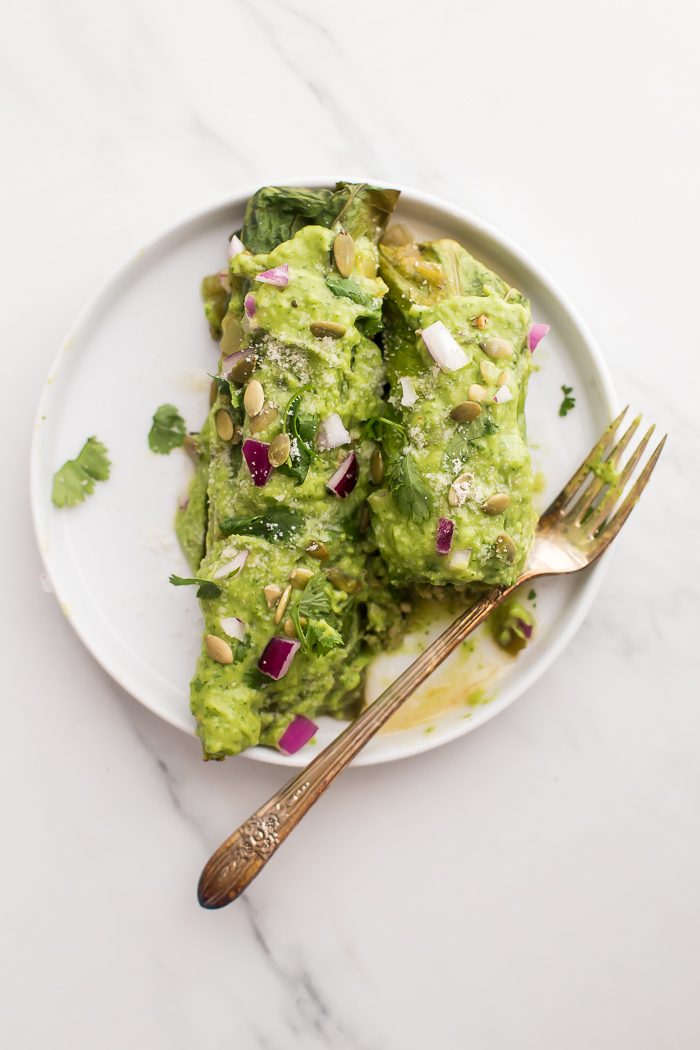 These Whole30 enchiladas are out of control! Stuffed with a roasted poblano pepper and ground pork mixture, seasoned with a, wait for it... cilantro-spinach-pepita pesto and plenty of mushrooms, they're the perfect Whole30 enchiladas recipe and they make a fantastic Whole30 dinner recipe. Topped with a rich, creamy avocado-cilantro sauce, you've got the best Whole30 enchiladas recipe ever... or maybe the best Whole30 dinner recipe ever? You decide. 