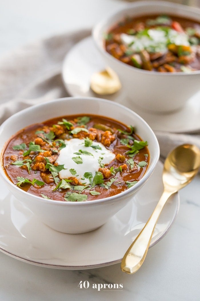 This chicken tikka masala chili is the stuff your dreams are made of. This Whole30 chili has a rich and creamy tomato sauce, with beautiful caramelized onions, garlic, and chiles, loaded with tender ground chicken and veggies. Inspired by my beloved chicken tikka masala recipe, this chicken tikka masala chili is a must make for fall! It'll surely become your favorite Whole30 chili, too.