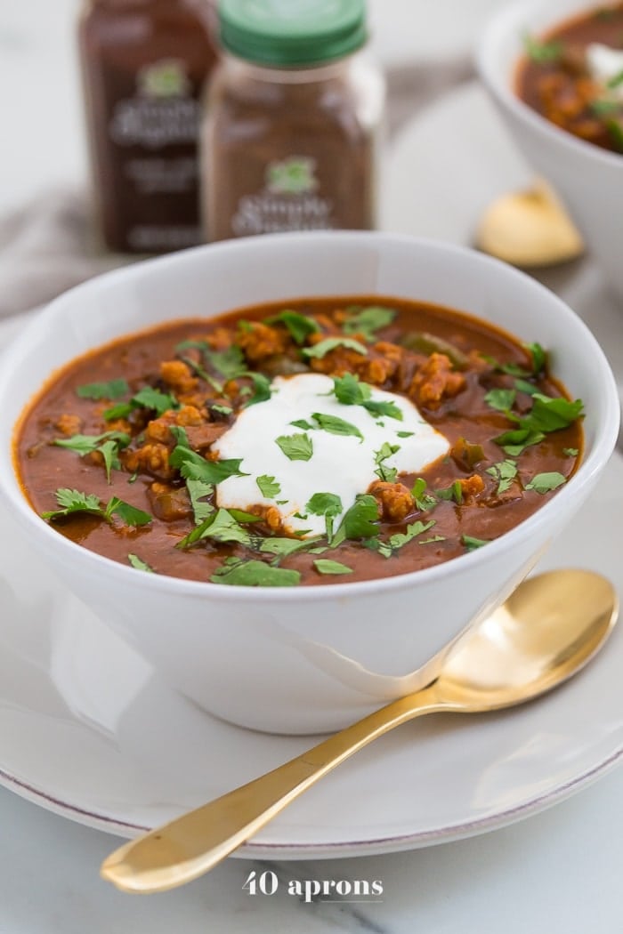 This chicken tikka masala chili is the stuff your dreams are made of. This Whole30 chili has a rich and creamy tomato sauce, with beautiful caramelized onions, garlic, and chiles, loaded with tender ground chicken and veggies. Inspired by my beloved chicken tikka masala recipe, this chicken tikka masala chili is a must make for fall! It'll surely become your favorite Whole30 chili, too.