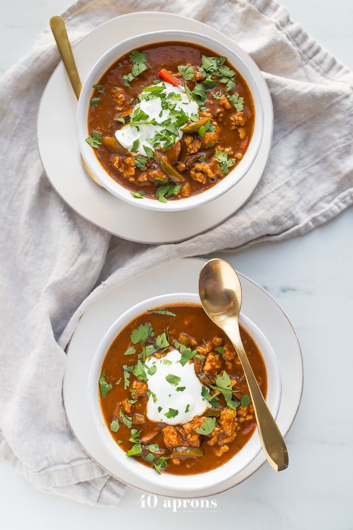 This chicken tikka masala chili is the stuff your dreams are made of. This Whole30 chili has a rich and creamy tomato sauce, with beautiful caramelized onions, garlic, and chiles, loaded with tender ground chicken and veggies. Inspired by my beloved chicken tikka masala recipe, this chicken tikka masala chili is a must make for fall! It'll surely become your favorite Whole30 chili, too.