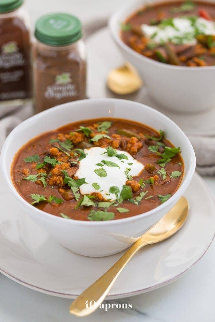 This chicken tikka masala chili is the stuff your dreams are made of. This Whole30 chili has a rich and creamy tomato sauce, with beautiful caramelized onions, garlic, and chiles, loaded with tender ground chicken and veggies. Inspired by my beloved chicken tikka masala recipe, this chicken tikka masala chili is a must make for fall! It'll surely become your favorite Whole30 chili, too.