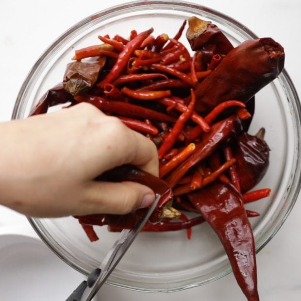 seeds being removed from a dries and soaked chili