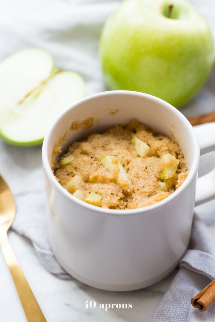 This paleo caramel apple microwave cake is indescribably good, with a moist cinnamon-spiced cake, tender green apples, and a 2-minute caramel sauce to top it all. I bet you'll make this paleo caramel apple microwave cake all the time, since it only take a few minutes to stir together and two minutes in the microwave to cook! This paleo caramel apple microwave cake is the perfect paleo microwave dessert. I'm obsessed!