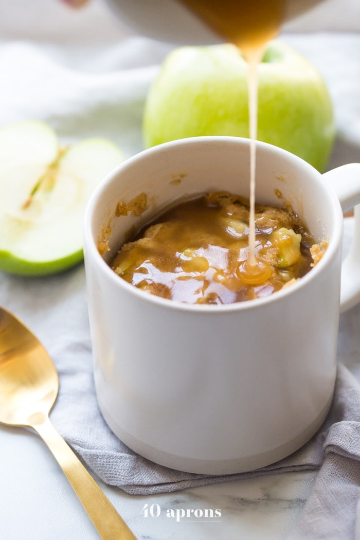 This paleo caramel apple microwave cake is indescribably good, with a moist cinnamon-spiced cake, tender green apples, and a 2-minute caramel sauce to top it all. I bet you'll make this paleo caramel apple microwave cake all the time, since it only take a few minutes to stir together and two minutes in the microwave to cook! This paleo caramel apple microwave cake is the perfect paleo microwave dessert. I'm obsessed!