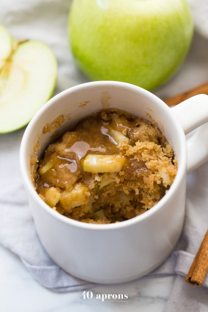 This paleo caramel apple microwave cake is indescribably good, with a moist cinnamon-spiced cake, tender green apples, and a 2-minute caramel sauce to top it all. I bet you'll make this paleo caramel apple microwave cake all the time, since it only take a few minutes to stir together and two minutes in the microwave to cook! This paleo caramel apple microwave cake is the perfect paleo microwave dessert. I'm obsessed!