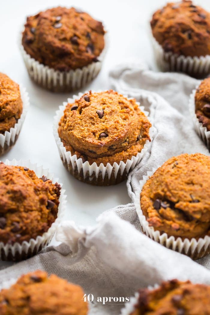 These paleo pumpkin chocolate chip muffins with cream cheese frosting are the perfect paleo fall recipe or paleo pumpkin recipe! They're moist and tender, loaded with pumpkin purée, dairy-free chocolate chips, and topped with a tangy but sweet frosting. And yep, they're entirely paleo. These paleo pumpkin chocolate chip muffins with cream cheese frosting are actually easy to make, too, so they'll become your very favorite paleo fall recipe or paleo pumpkin recipe for sure!