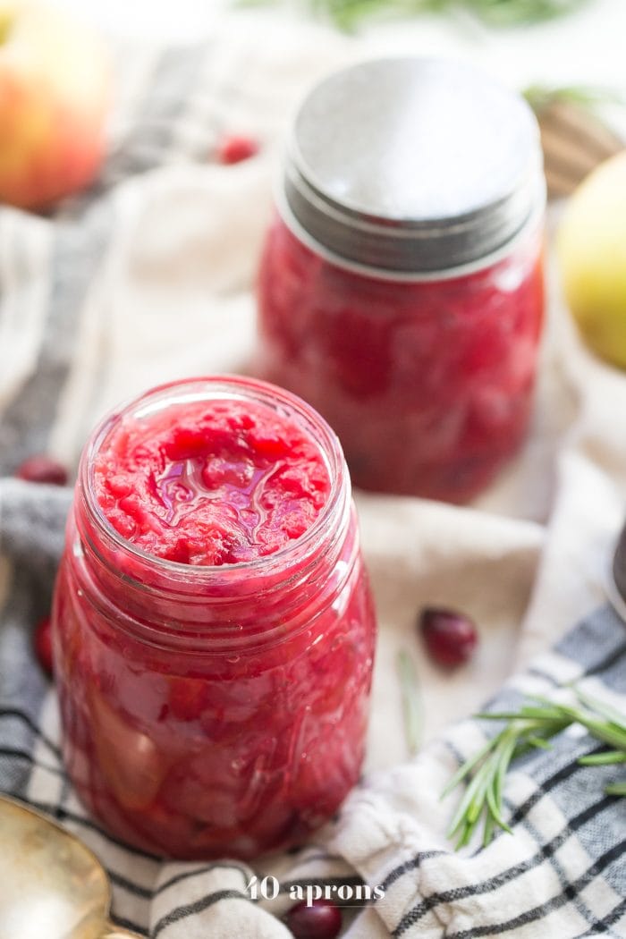 This Instant Pot Whole30 cranberry sauce with apples and rosemary is the perfect Whole30 cranberry sauce: sweet and tart with no added sweeteners at all! It's the perfect addition to any Whole30 Thanksgiving table and goes beautifully with my Whole30 green bean casserole. You'll love this Instant Pot Whole30 cranberry sauce with apples and rosemary because it's so easy and quick yet gourmet!