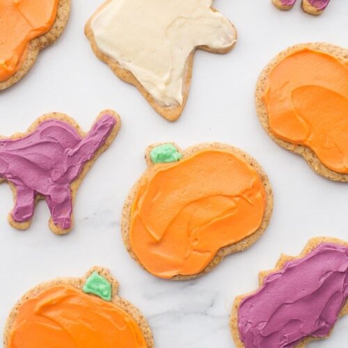 These paleo Halloween cookies are almost too cute to handle. Tender and soft with a paleo buttercream-style frosting, these paleo Halloween cookies are a must for this holiday! Whether you cut them into pumpkins, ghosts, or bats (or maybe zombies, anyone?), these paleo Halloween cookies are a healthier way to enjoy the classic holiday treat. No tricks here!