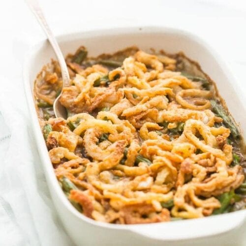 This Whole30 green bean casserole is just like the classic Thanksgiving dish: tender green beans in a rich cream of mushroom sauce, topped with fried onion straws. This Whole30 green bean casserole (also a paleo green bean casserole, of course!) is an absolute must for the Whole30 Thanksgiving table. And to be honest, this paleo green bean casserole tastes even better than the classic version! 