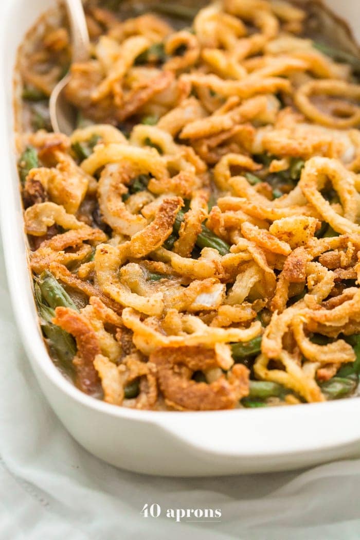 This Whole30 green bean casserole is just like the classic Thanksgiving dish: tender green beans in a rich cream of mushroom sauce, topped with fried onion straws. This Whole30 green bean casserole (also a paleo green bean casserole, of course!) is an absolute must for the Whole30 Thanksgiving table. And to be honest, this paleo green bean casserole tastes even better than the classic version! 