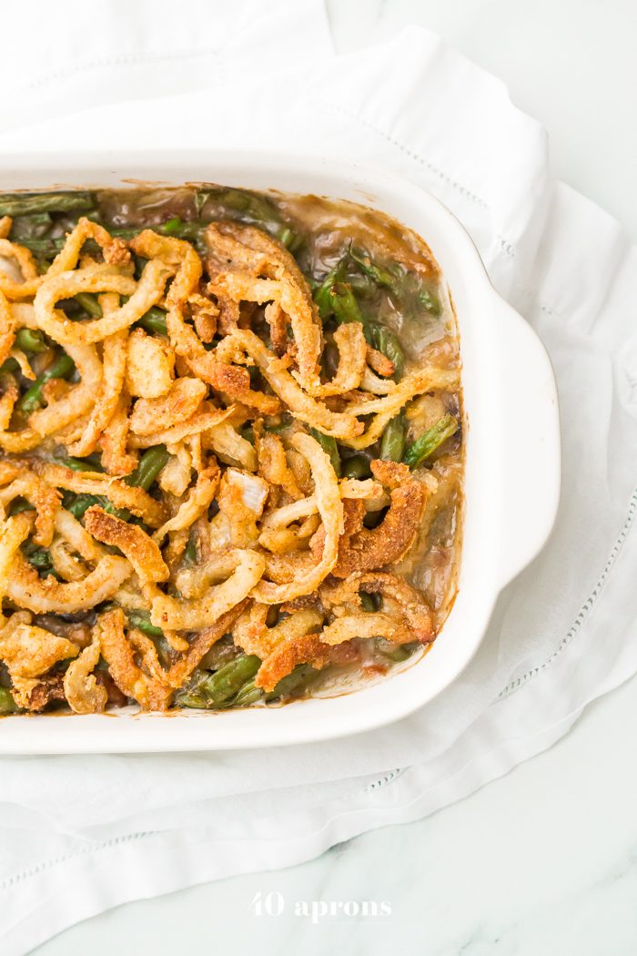 This Whole30 green bean casserole is just like the classic Thanksgiving dish: tender green beans in a rich cream of mushroom sauce, topped with fried onion straws. This Whole30 green bean casserole (also a paleo green bean casserole, of course!) is an absolute must for the Whole30 Thanksgiving table. And to be honest, this paleo green bean casserole tastes even better than the classic version! 