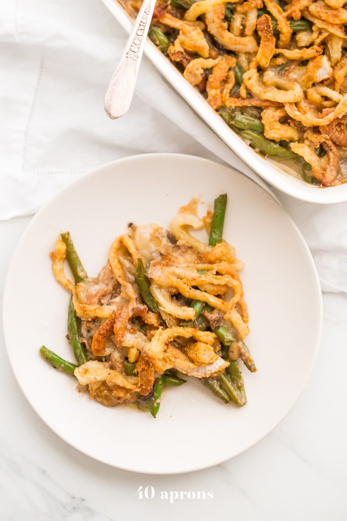 This Whole30 green bean casserole is just like the classic Thanksgiving dish: tender green beans in a rich cream of mushroom sauce, topped with fried onion straws. This Whole30 green bean casserole (also a paleo green bean casserole, of course!) is an absolute must for the Whole30 Thanksgiving table. And to be honest, this paleo green bean casserole tastes even better than the classic version! 