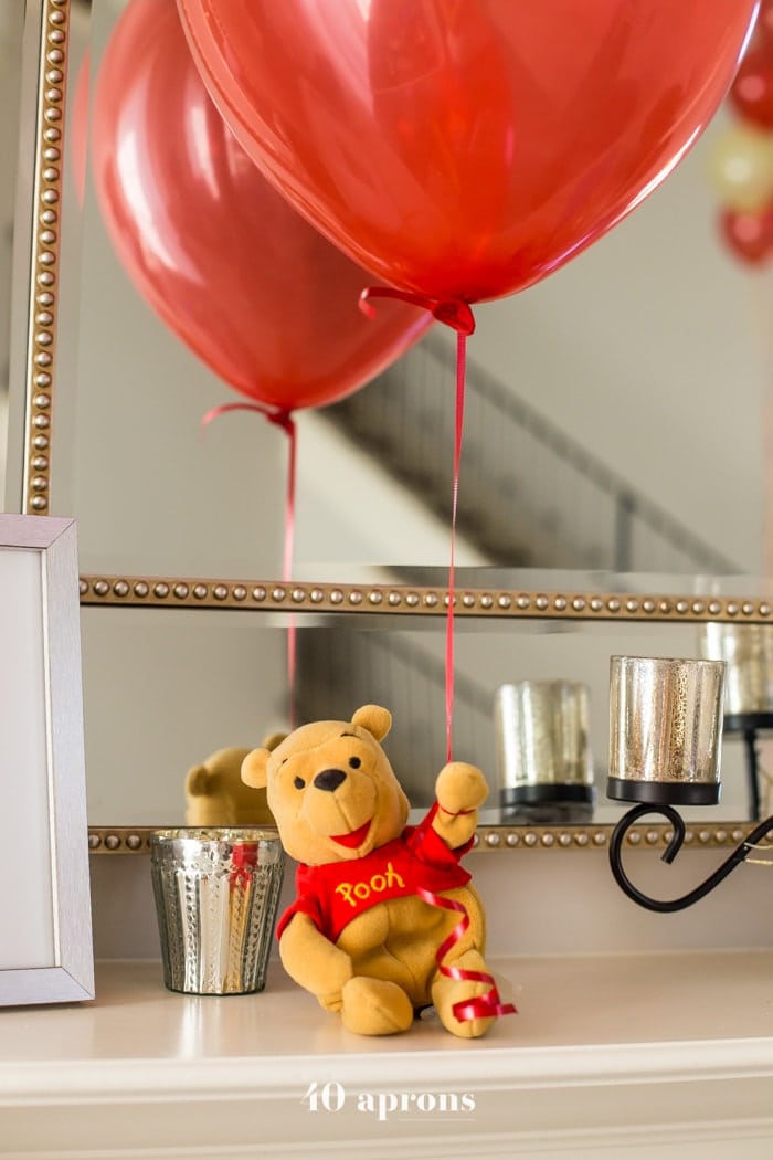 This DIY Winnie the Pooh birthday party is too cute! With tons of Winnie the Pooh birthday party ideas, this is your Winnie the Pooh birthday party guide. Happy birthday, little one! It'd make a great Winnie the Pooh baby shower, too.