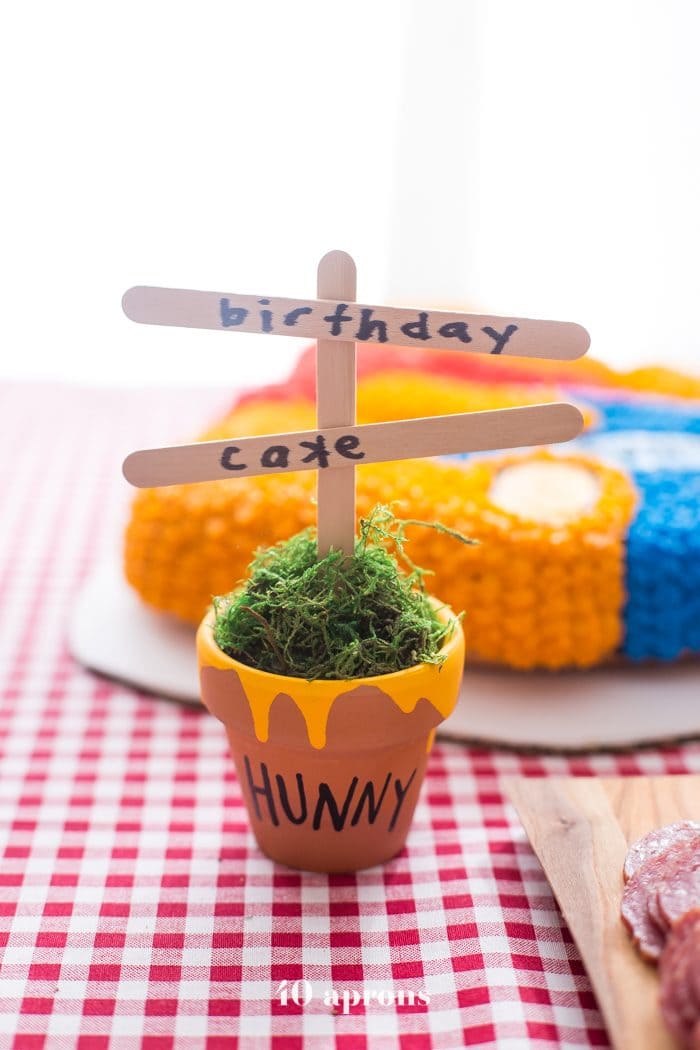 This DIY Winnie the Pooh birthday party is too cute! With tons of Winnie the Pooh birthday party ideas, this is your Winnie the Pooh birthday party guide. Happy birthday, little one! It'd make a great Winnie the Pooh baby shower, too.