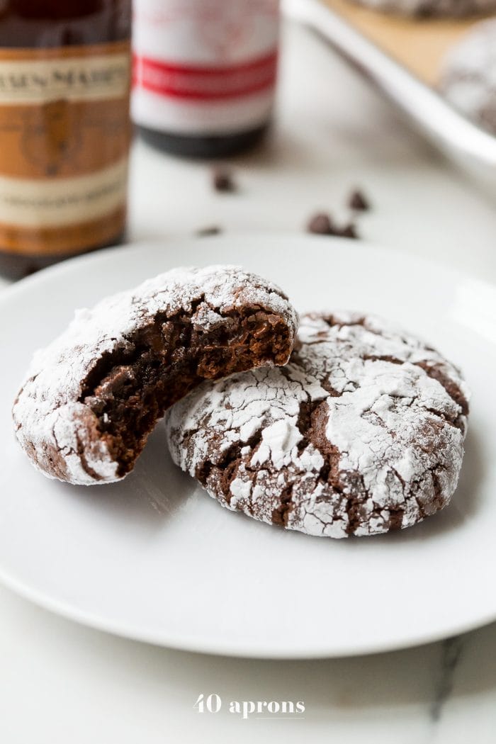 These peppermint paleo gluten-free crinkle cookies are fudgy and rich, perfect for the holidays. Grain-free and refined-sugar-free, these paleo gluten-free crinkle cookies are a guilt-free way to indulge in holiday treats without breaking your commitment to a healthier lifestyle. These paleo gluten-free crinkle cookies have hints of peppermint, making them positively festive. Your friends and family will never believe these gluten-free crinkle cookies are paleo!