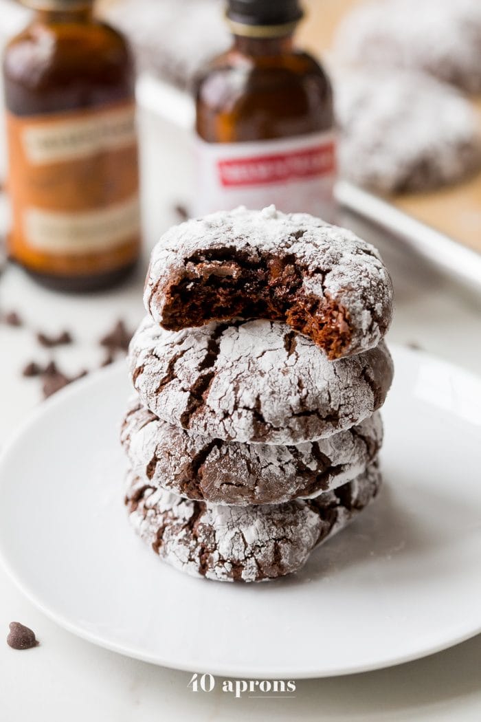 These peppermint paleo gluten-free crinkle cookies are fudgy and rich, perfect for the holidays. Grain-free and refined-sugar-free, these paleo gluten-free crinkle cookies are a guilt-free way to indulge in holiday treats without breaking your commitment to a healthier lifestyle. These paleo gluten-free crinkle cookies have hints of peppermint, making them positively festive. Your friends and family will never believe these gluten-free crinkle cookies are paleo!