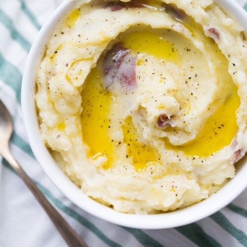 These Whole30 Instant Pot mashed potatoes with garlic and herbs are a Whole30 Thanksgiving dream: rich, creamy, garlicky, and so easy. These Whole30 Instant Pot mashed potatoes are a must for any paleo Thanksgiving table or Whole30 Thanksgiving table, and they'll become your favorite paleo Instant Pot mashed potatoes recipe for sure!