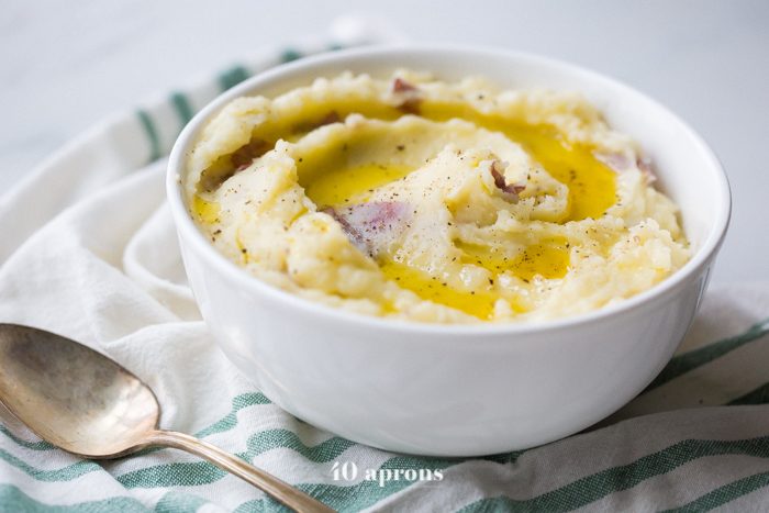 These Whole30 Instant Pot mashed potatoes with garlic and herbs are a Whole30 Thanksgiving dream: rich, creamy, garlicky, and so easy. These Whole30 Instant Pot mashed potatoes are a must for any paleo Thanksgiving table or Whole30 Thanksgiving table, and they'll become your favorite paleo Instant Pot mashed potatoes recipe for sure!